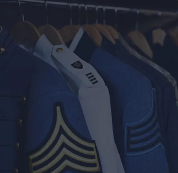 3.-Former-military Old military uniforms hanging in a closet