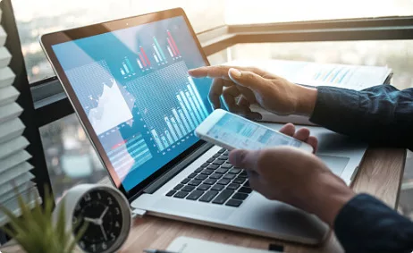 4.-investment-management Laptop with chart on it